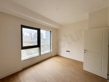 Bright and spacious bedroom area of a modern apartment.