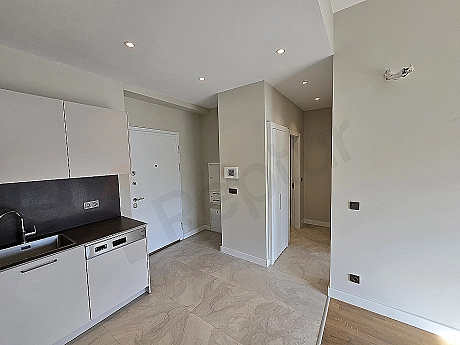 Interior of a modern, well-lit, spacious corridor