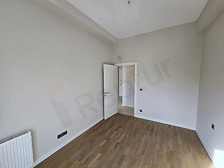 Modern bedroom interior with stylish bed, nightstand, and decorative lighting details