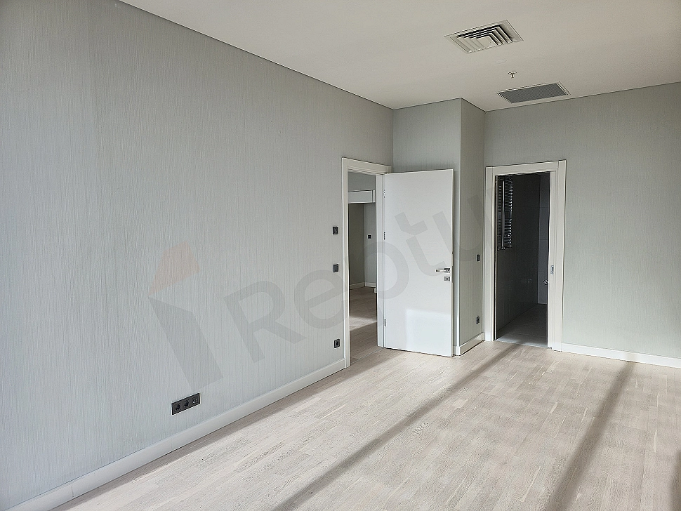 Modern bedroom interior: spacious double bed, wooden nightstand, stylish bedside lamp, neutral color palette, minimalist design