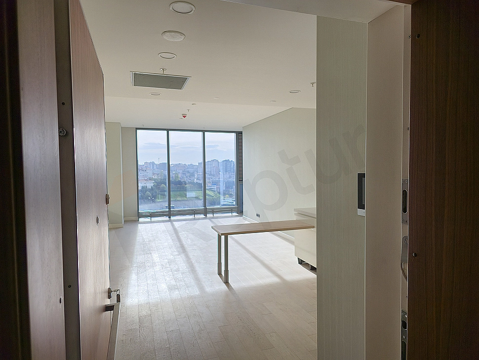Modern apartment entrance area. Illuminated hallway, stylish wardrobe and mirror detail.