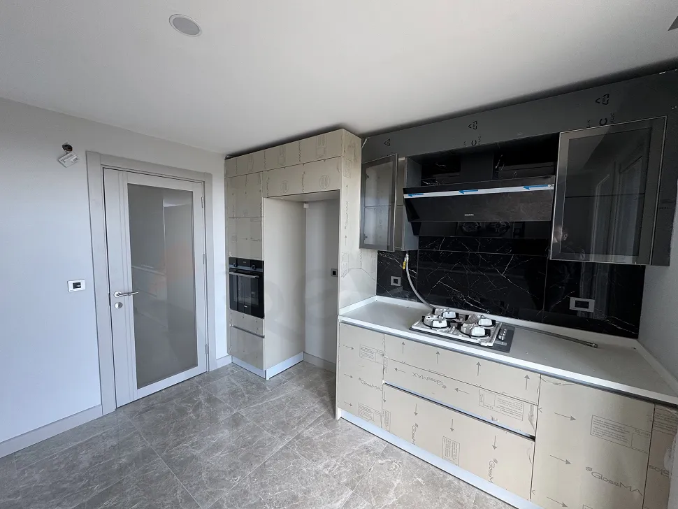 Spacious and bright kitchen area with a modern design.