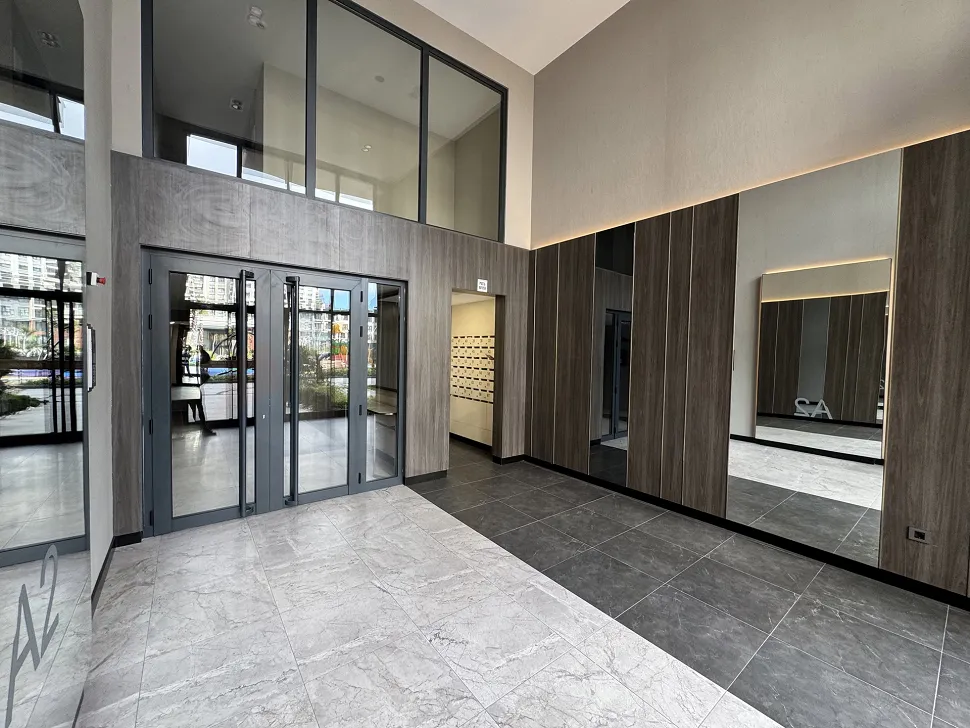 Modern design spacious elevator cabin with mirrors.
