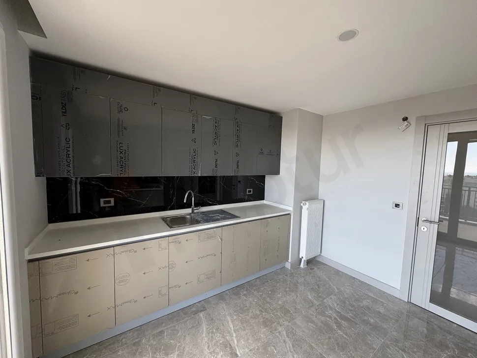 Modernly designed, spacious and bright kitchen area.