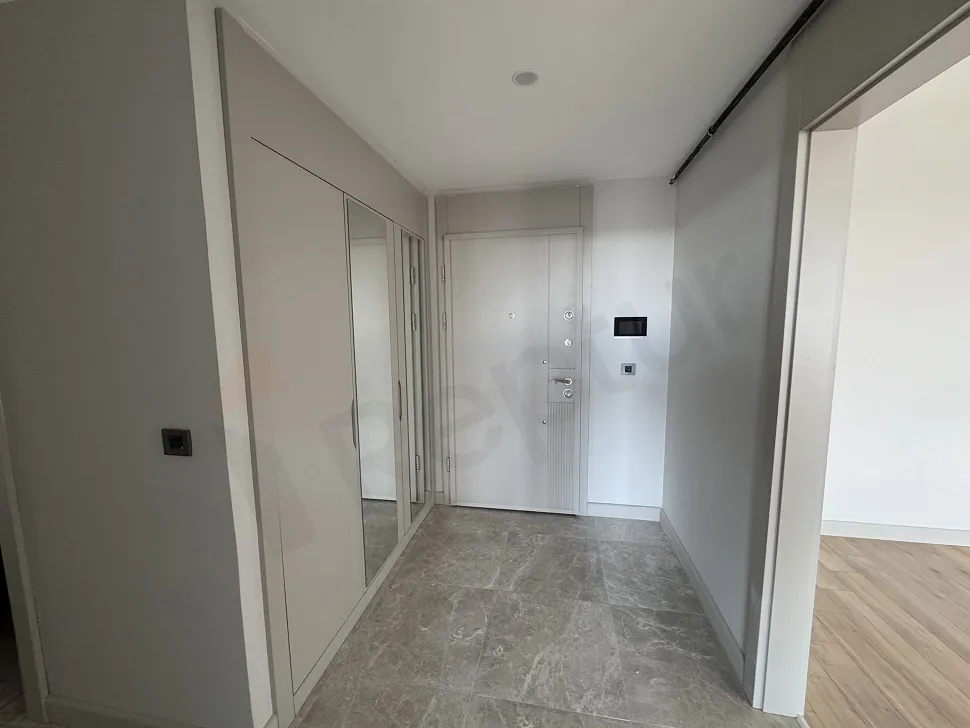 Entrance hall and stylish steel door view of a modern apartment.
