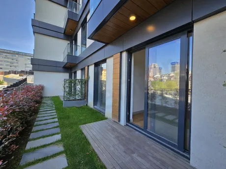 A modern and spacious apartment terrace with a city view.