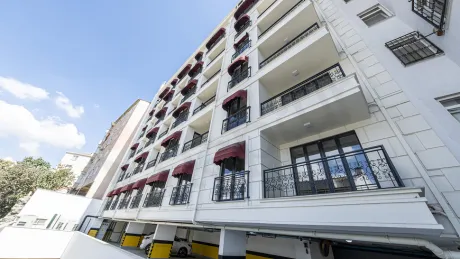 Exterior facade view of a modern luxury residential building located on the seafront in Beyoglu, Istanbul.
