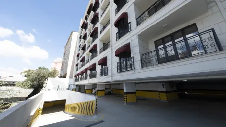 Exterior facade of a modern residential building located on the seafront in Beyoglu, Istanbul.