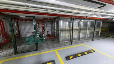 Spacious and organized open and indoor parking area of a modern residential project.