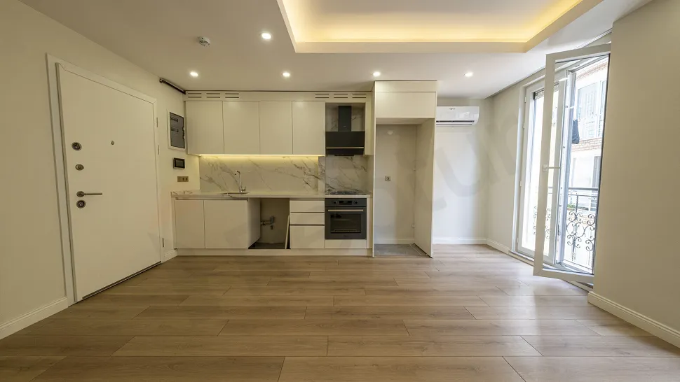 Modernly designed, spacious and bright kitchen area.