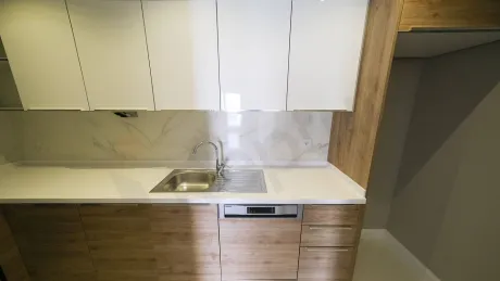 Spacious kitchen area with a modern and stylish design.