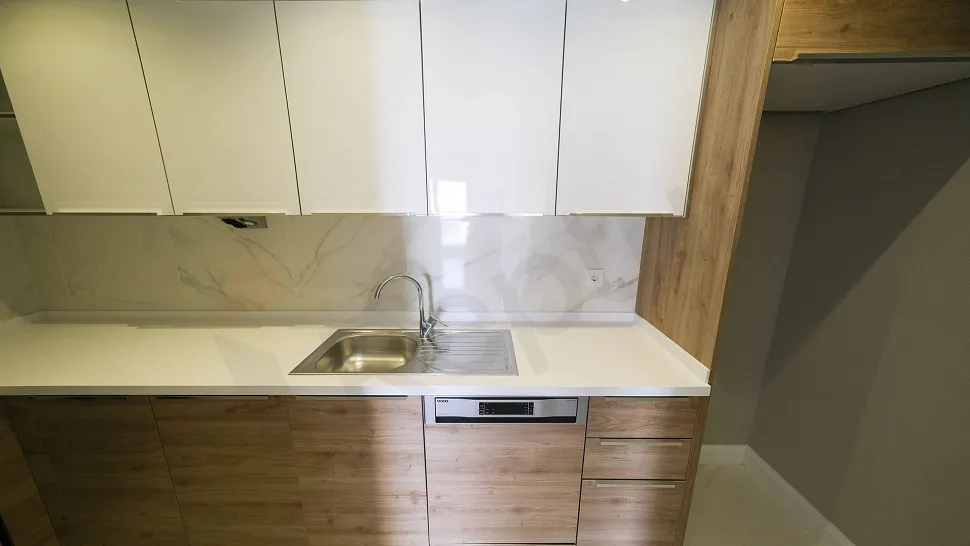 Spacious kitchen area with a modern and stylish design.