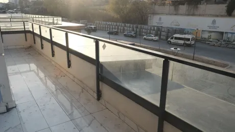 Wide and spacious balcony area of a modern building in Basaksehir.