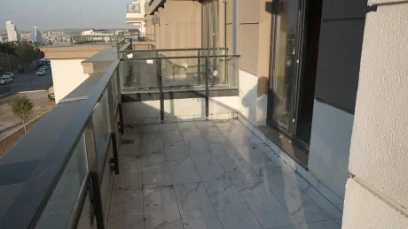 Spacious and functional balcony area of a modern shop.