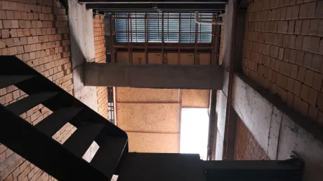 Stylish interior staircase design located inside a modern commercial shop or store.
