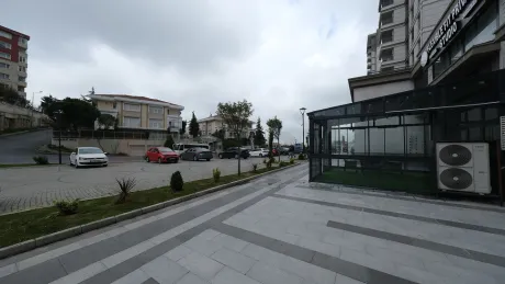 Landscaped garden and outdoor area of the commercial shop for sale in Basaksehir.