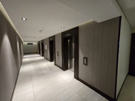 Spacious, bright, and airy corridor of a modern residence apartment.