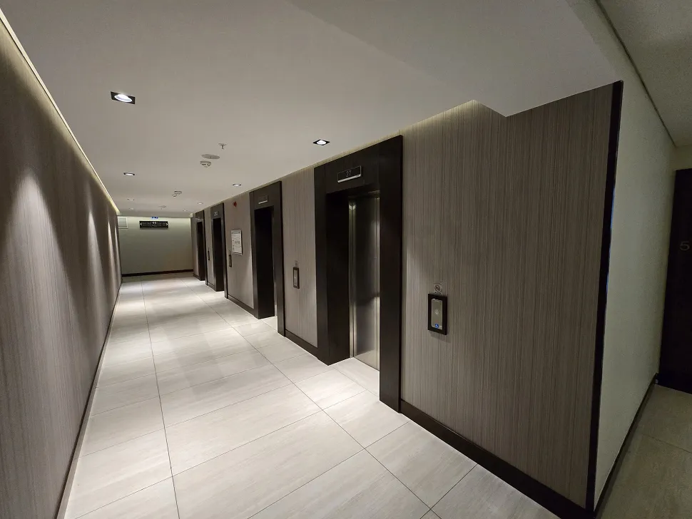 Spacious, bright, and airy corridor of a modern residence apartment.