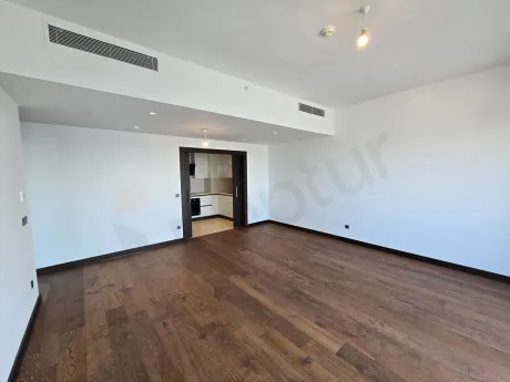 A modern, spacious, and bright living room area located in Şişli, Istanbul.