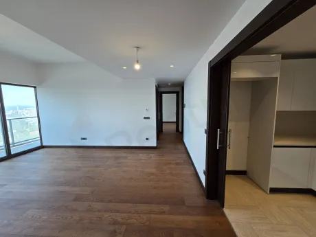Spacious and bright dining room area of a modern apartment.