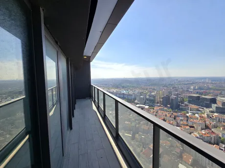 Spacious balcony area of a modern residence apartment in Sisli opening to a city view.