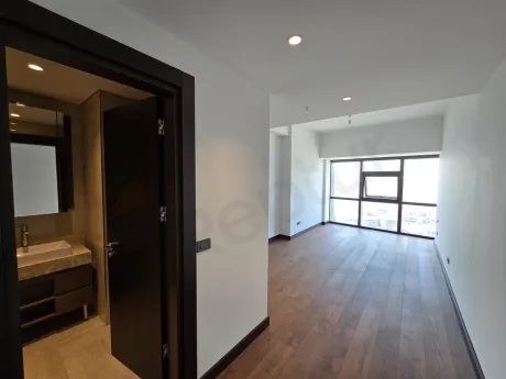 Modern and spacious bedroom with large windows in a luxury residence apartment in Sisli, Istanbul.