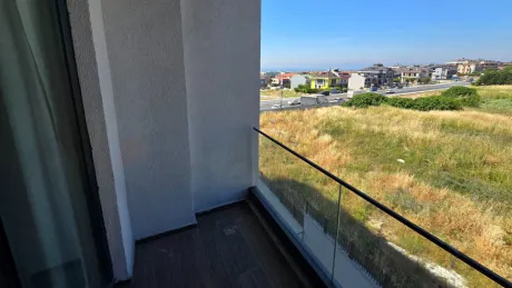 Spacious and airy balcony of a modern apartment with a city view