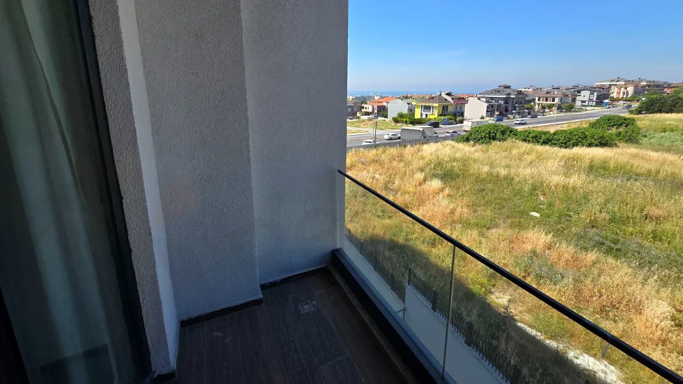 Spacious and airy balcony of a modern apartment with a city view