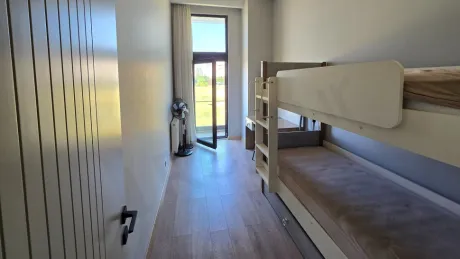 View of a spacious and modern balcony of an apartment.