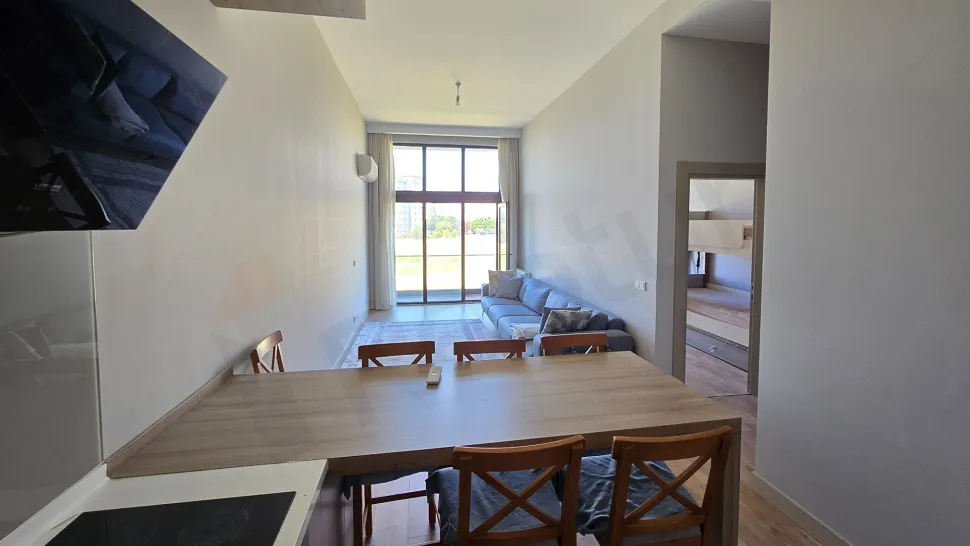Spacious and bright dining room area with modern architecture and large windows.