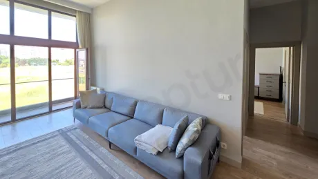 A view of a modern, spacious, and bright living room in a 2+1 apartment in Beylikdüzü.