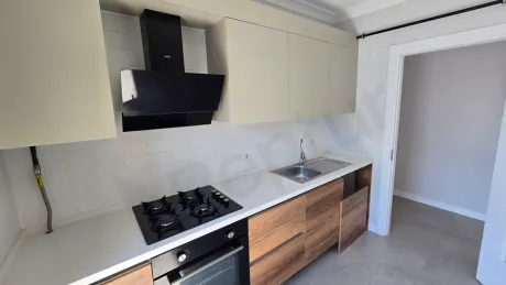 Spacious and bright kitchen section with modern architecture.