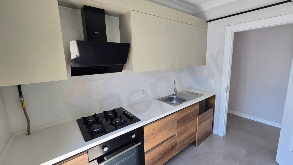 Spacious and bright kitchen section with modern architecture.