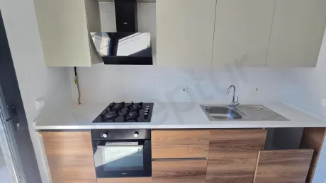 Modern and bright kitchen design of a 2+1 apartment located in Kucukcekmece.