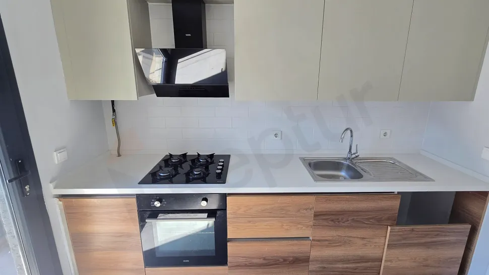 Modern and bright kitchen design of a 2+1 apartment located in Kucukcekmece.