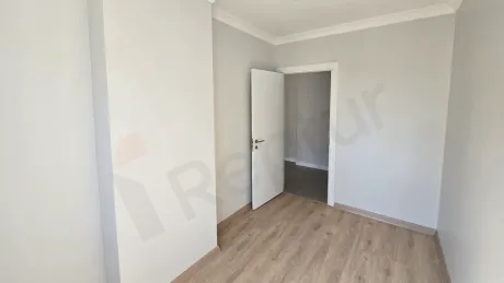Spacious and bright bedroom interior of a modern apartment for sale in Kucukcekmece, Istanbul.