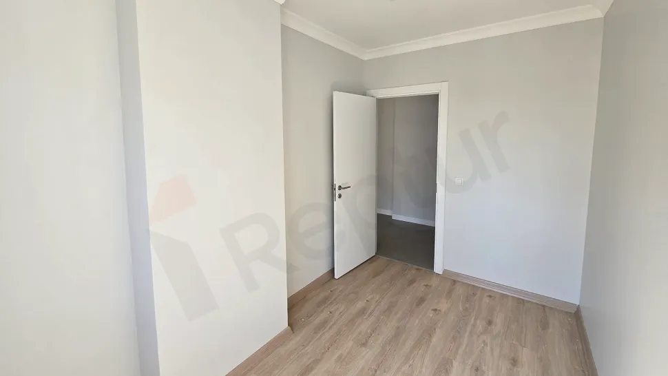 Spacious and bright bedroom interior of a modern apartment for sale in Kucukcekmece, Istanbul.