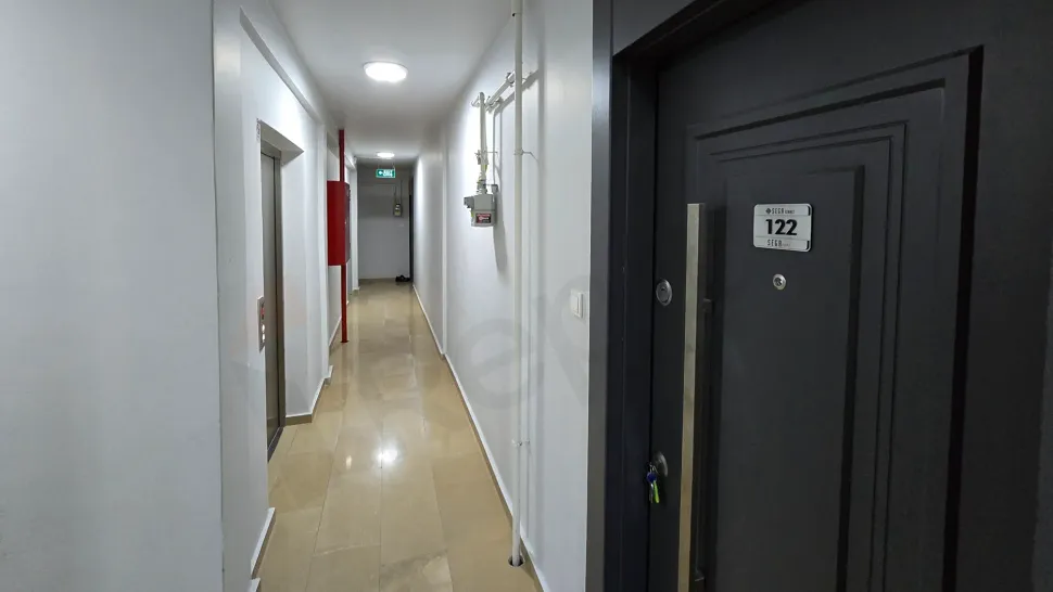 Spacious and bright apartment entrance area inside a modern building.