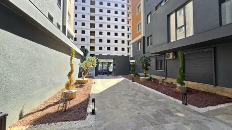 Landscaped spacious green garden of a modern residential complex in Kucukcekmece.