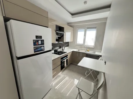 Modern and spacious kitchen area of a 2+1 apartment for sale in Kartal.