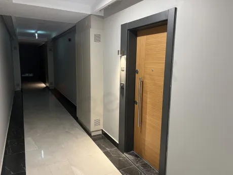 Modern entrance door and hallway area of a 2+1 apartment for sale in Kartal.