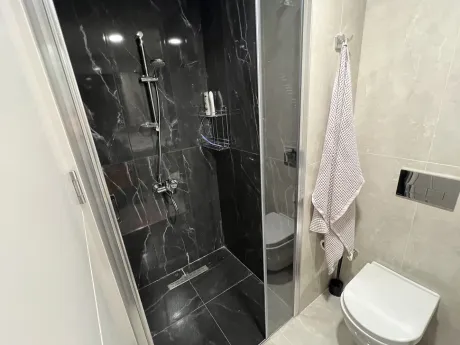 Modern and spacious bathroom interior with stylish fixtures and elegant design.