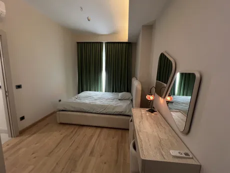 View of a modern and spacious bedroom.