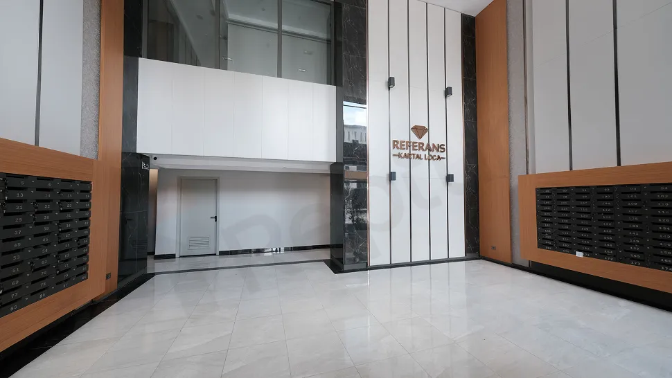 Elegant lobby area and waiting lounge of a modern and spacious residence project.