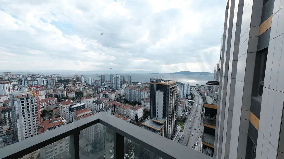 View of a large and spacious balcony area in a modern building.