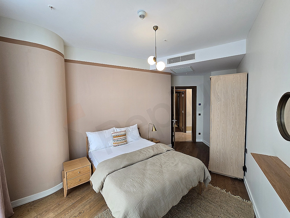 Stylish and modernly designed, furnished bedroom.