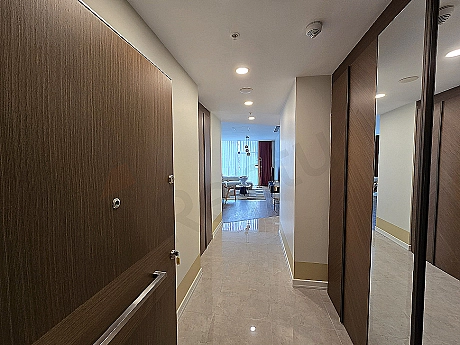 Modern apartment entrance area, wooden door and stylish lighting detail