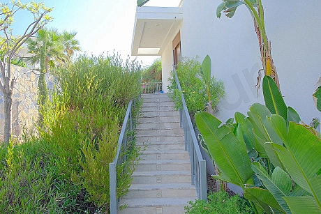 Main entrance door of a stylish apartment. A clean and modern interior door with bright walls and flooring around it.