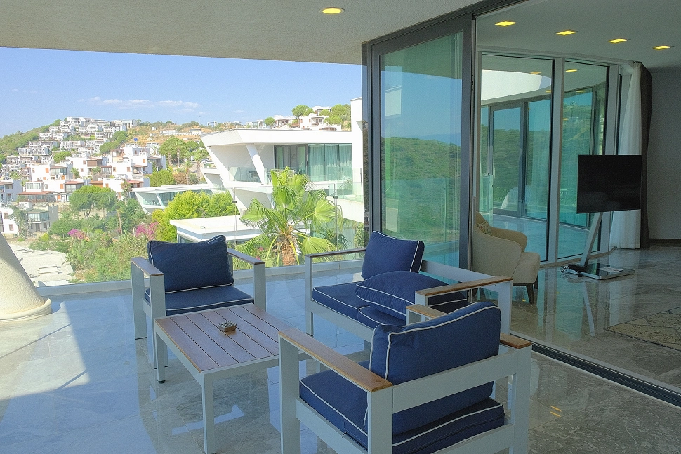 A spacious terrace with a breathtaking view of the deep blue Mediterranean Sea.