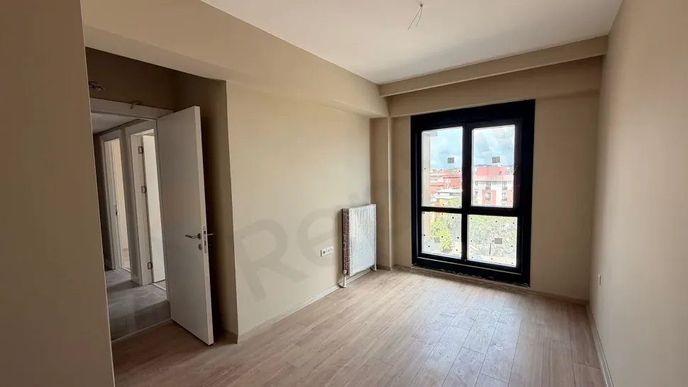 Bedroom area of a modern and bright apartment.